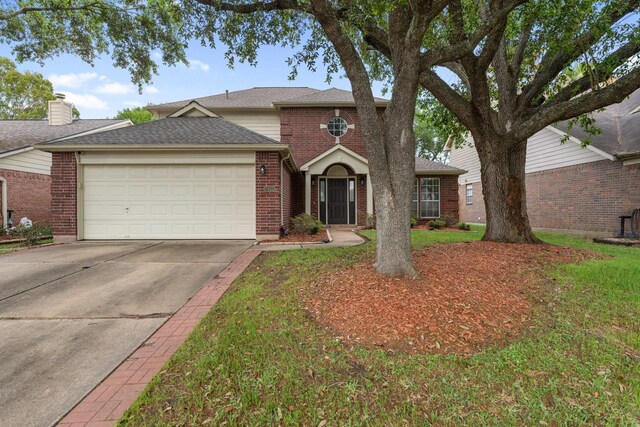 7015 Redwood Falls Dr, Pasadena, TX 77505 - traditional-style home with a garage, driveway, brick siding, and a shingled roof