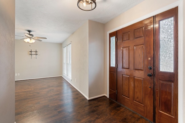 7015 Redwood Falls Dr, Pasadena, TX 77505 - foyer entrance with a ceiling fan, dark wood-style floors, and a textured ceiling