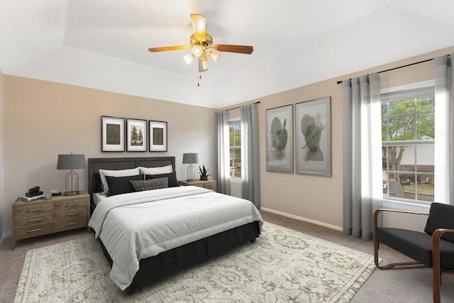7015 Redwood Falls Dr, Pasadena, TX 77505 - bedroom featuring carpet, multiple windows, a ceiling fan, and a tray ceiling