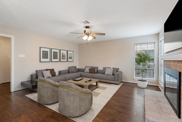 7015 Redwood Falls Dr, Pasadena, TX 77505 - living room with wood finished floors, a ceiling fan, and a brick fireplace