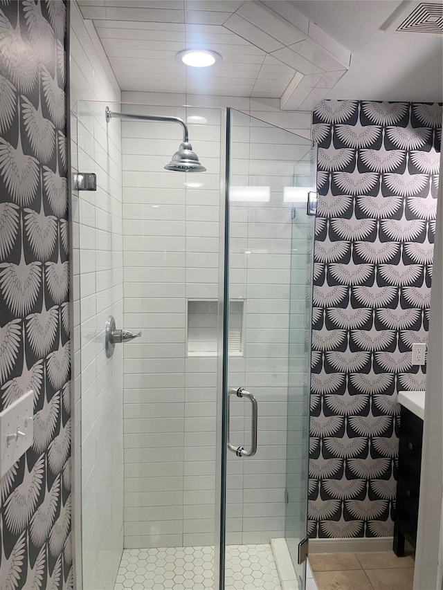 142 Beverly Ln, Bellaire, TX 77401 - bathroom with a stall shower and tile patterned floors