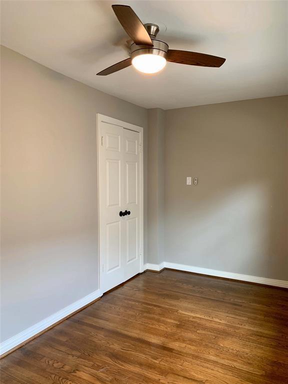 142 Beverly Ln, Bellaire, TX 77401 - unfurnished room with a ceiling fan and dark wood finished floors
