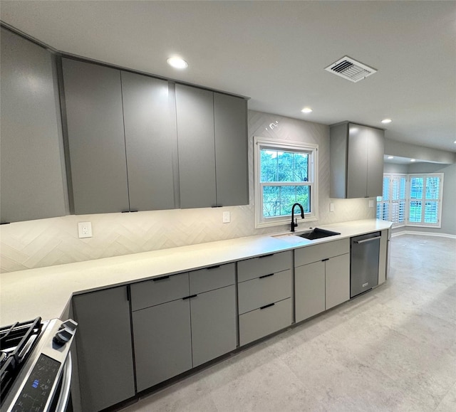 142 Beverly Ln, Bellaire, TX 77401 - kitchen with appliances with stainless steel finishes, gray cabinetry, light countertops, and recessed lighting