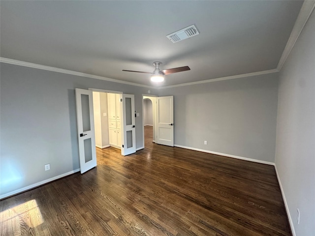 142 Beverly Ln, Bellaire, TX 77401 - unfurnished bedroom featuring dark wood-type flooring, ornamental molding, and a ceiling fan