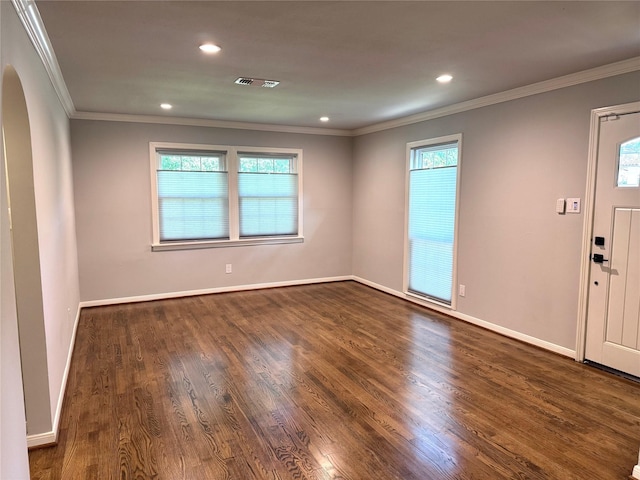 142 Beverly Ln, Bellaire, TX 77401 - unfurnished room featuring arched walkways, dark wood-type flooring, crown molding, and recessed lighting