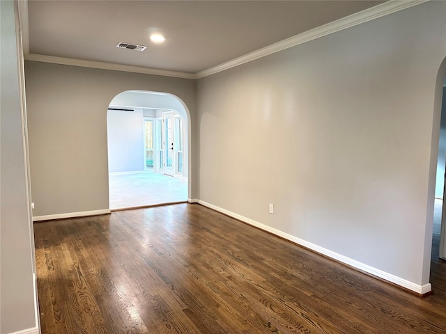 142 Beverly Ln, Bellaire, TX 77401 - empty room featuring arched walkways, ornamental molding, dark wood finished floors, and recessed lighting