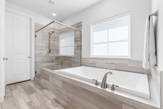 5658 Darling St, Houston, TX 77007 - bathroom featuring a garden tub and a shower stall