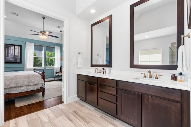 5658 Darling St, Houston, TX 77007 - full bathroom featuring double vanity, ensuite bath, ceiling fan, a baseboard heating unit, and recessed lighting