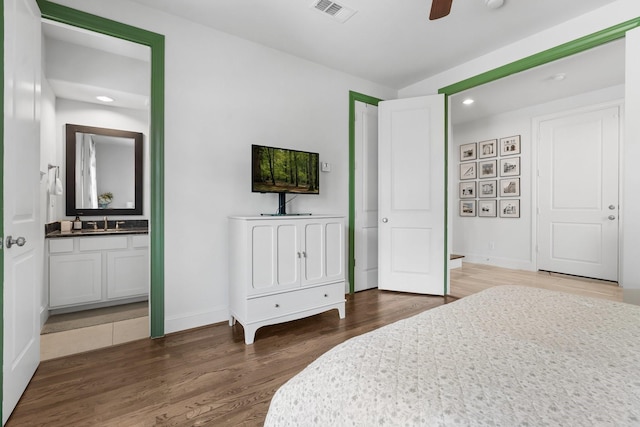 5658 Darling St, Houston, TX 77007 - bedroom featuring wood finished floors, recessed lighting, and ensuite bath