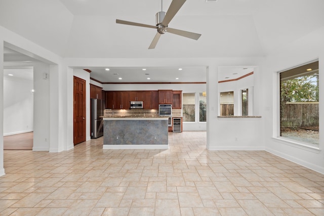 3118 Rosemary Park Ln, Houston, TX 77082 - kitchen featuring stainless steel appliances, stone tile flooring, decorative backsplash, beverage cooler, and ceiling fan