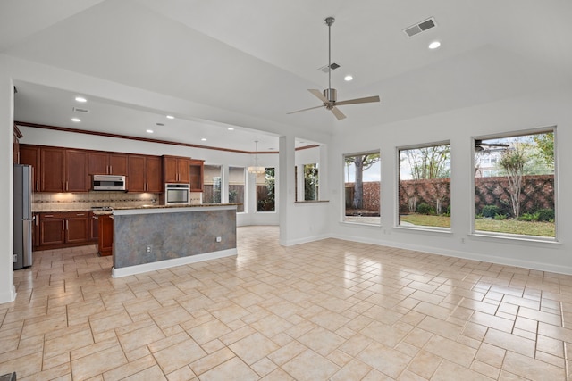 3118 Rosemary Park Ln, Houston, TX 77082 - kitchen featuring appliances with stainless steel finishes, backsplash, open floor plan, ceiling fan, and recessed lighting