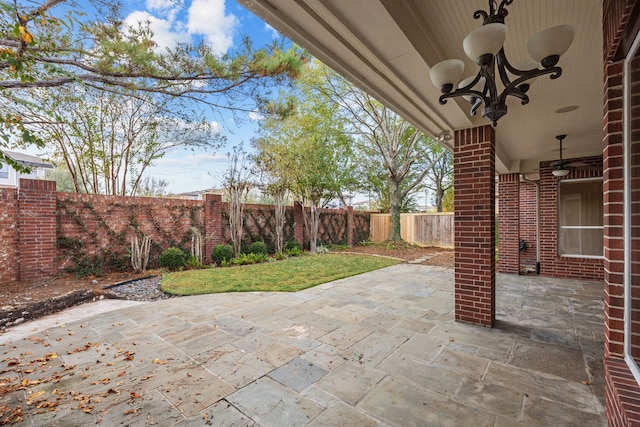 3118 Rosemary Park Ln, Houston, TX 77082 - fenced backyard with ceiling fan and a patio area