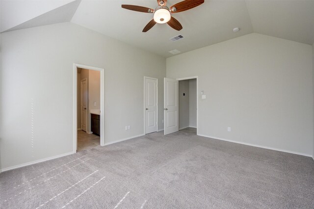 32014 Quail Terrace Ln, Conroe, TX 77385 - unfurnished bedroom with lofted ceiling, light colored carpet, ensuite bathroom, and ceiling fan