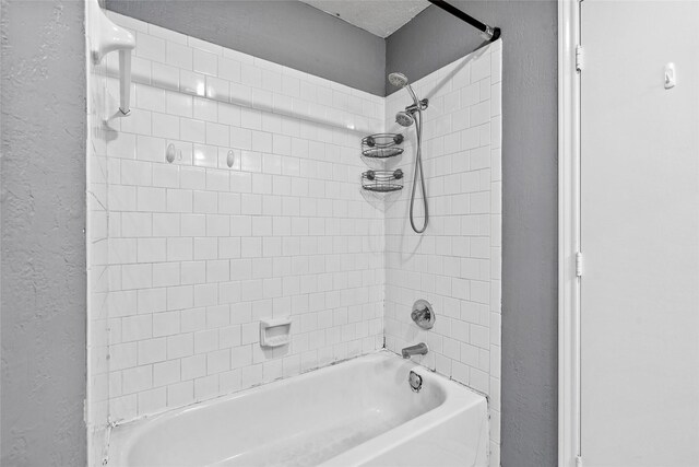 2721 Overland Trl, Dickinson, TX 77539 - bathroom featuring a textured wall and shower / bath combination