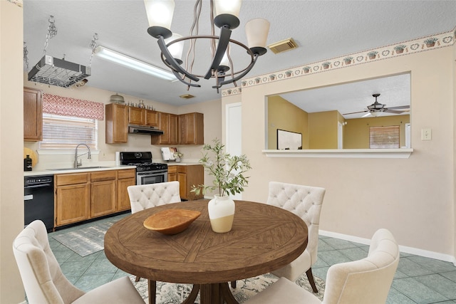 2721 Overland Trl, Dickinson, TX 77539 - dining room featuring a chandelier, light tile patterned floors, ceiling fan, and a textured ceiling