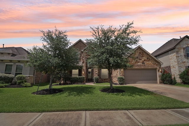 15521 Atwood Bay Trl, Cypress, TX 77433 - view of front of home with an attached garage, concrete driveway, stone siding, and a front yard
