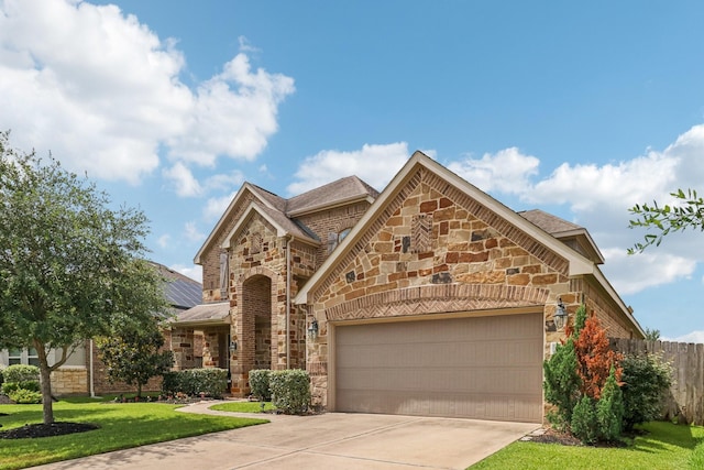 15521 Atwood Bay Trl, Cypress, TX 77433 - view of front facade with stone siding, driveway, and an attached garage