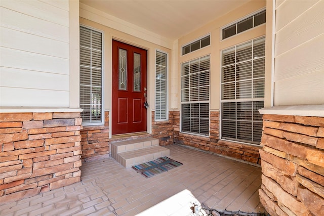 2223 Ridge Wood Ln, Sugar Land, TX 77479 - doorway to property featuring a porch and stone siding