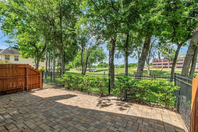 2223 Ridge Wood Ln, Sugar Land, TX 77479 - fenced backyard featuring a patio area