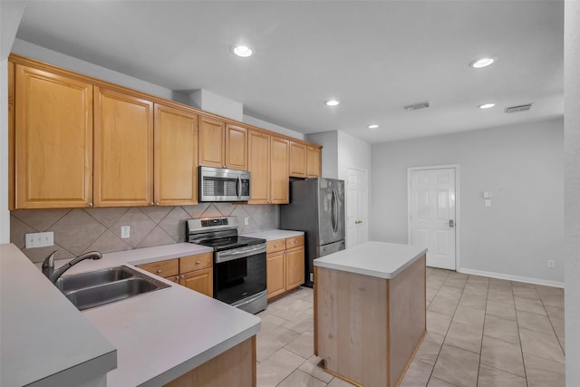 2223 Ridge Wood Ln, Sugar Land, TX 77479 - kitchen featuring stainless steel appliances, decorative backsplash, light countertops, recessed lighting, and a center island