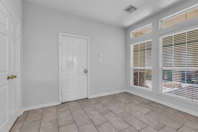 2223 Ridge Wood Ln, Sugar Land, TX 77479 - unfurnished room with plenty of natural light and light tile patterned floors