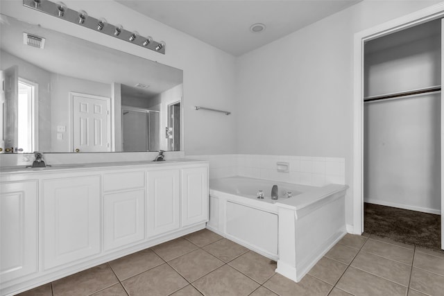 2223 Ridge Wood Ln, Sugar Land, TX 77479 - bathroom featuring tile patterned flooring, a bath, a shower stall, and double vanity
