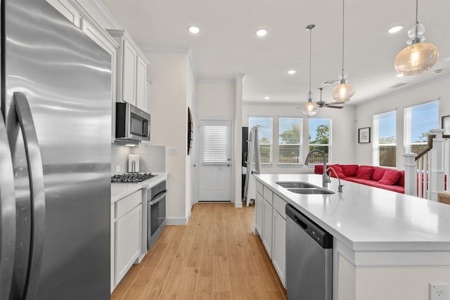 3207 Cedar Dawn Ln, Houston, TX 77091 - kitchen featuring stainless steel appliances, recessed lighting, open floor plan, light countertops, and white cabinets