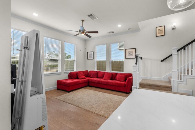 3207 Cedar Dawn Ln, Houston, TX 77091 - living room featuring ceiling fan, ornamental molding, stairs, light wood-style floors, and recessed lighting
