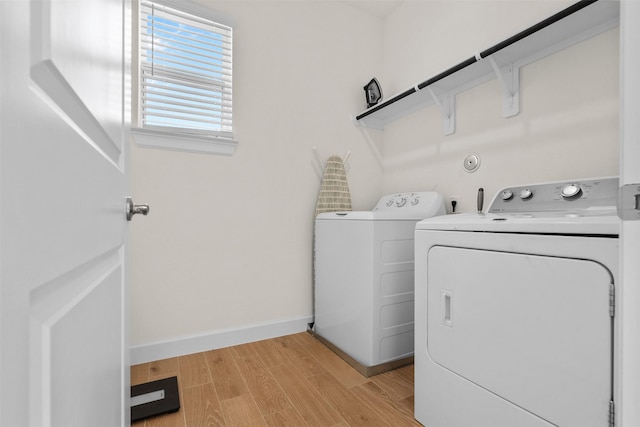 3207 Cedar Dawn Ln, Houston, TX 77091 - washroom with independent washer and dryer and light wood-style flooring