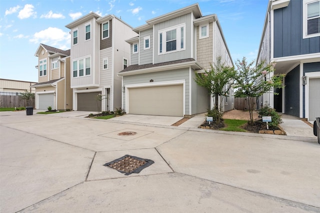 3207 Cedar Dawn Ln, Houston, TX 77091 - multi unit property with an attached garage, concrete driveway, and board and batten siding