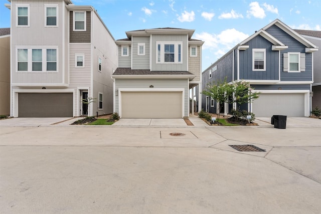 3207 Cedar Dawn Ln, Houston, TX 77091 - view of front facade featuring a garage, driveway, and board and batten siding