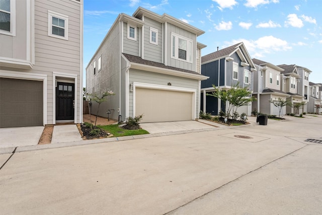 3207 Cedar Dawn Ln, Houston, TX 77091 - multi unit property with a garage, a residential view, driveway, and board and batten siding