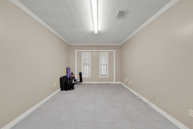 1931 Ansbury Dr, Houston, TX 77018 - spare room featuring crown molding, light tile patterned floors, and a textured ceiling