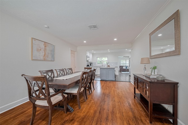 1931 Ansbury Dr, Houston, TX 77018 - dining room with crown molding, wood finished floors, and recessed lighting