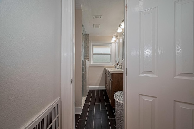 1931 Ansbury Dr, Houston, TX 77018 - bathroom with vanity, a stall shower, wood finish floors, and crown molding