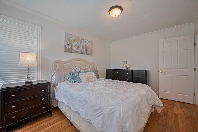 1931 Ansbury Dr, Houston, TX 77018 - bedroom with light wood-style flooring and crown molding