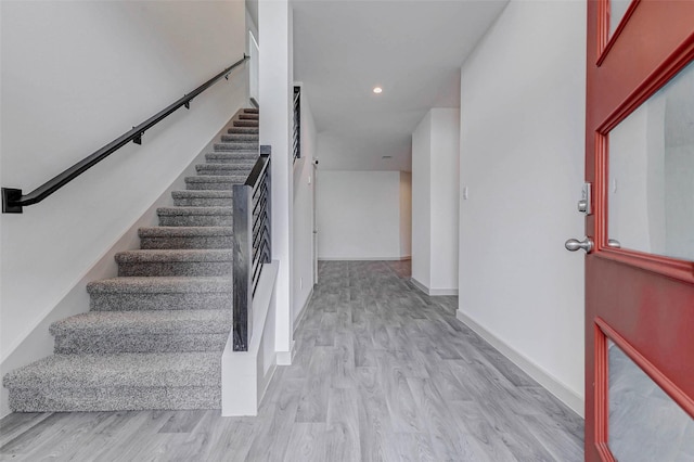 3026 Stock Orchard Ln, Houston, TX 77047 - stairway featuring wood finished floors and recessed lighting
