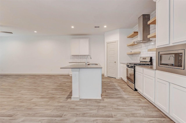 3026 Stock Orchard Ln, Houston, TX 77047 - kitchen with stainless steel appliances, open shelves, wall chimney exhaust hood, light wood finished floors, and backsplash
