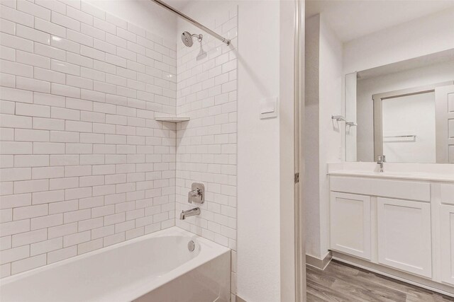 3026 Stock Orchard Ln, Houston, TX 77047 - bathroom featuring vanity, wood finished floors, and shower / bath combination