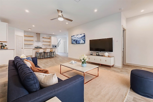 3026 Stock Orchard Ln, Houston, TX 77047 - living room featuring a ceiling fan, recessed lighting, and light wood finished floors