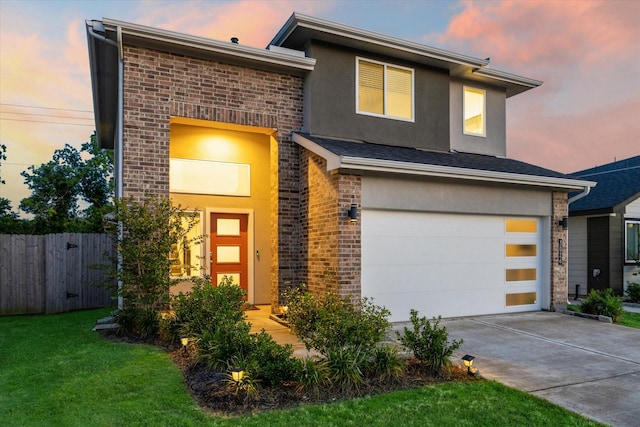 3026 Stock Orchard Ln, Houston, TX 77047 - contemporary home featuring driveway, stucco siding, and an attached garage