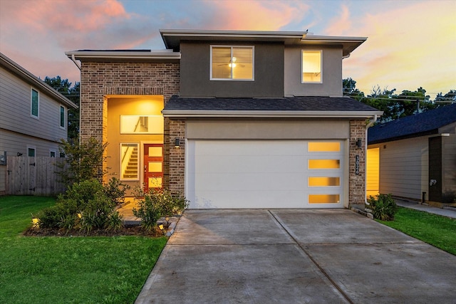 3026 Stock Orchard Ln, Houston, TX 77047 - view of front facade with concrete driveway, an attached garage, brick siding, and stucco siding