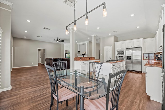 9618 Roarks Psge, Missouri City, TX 77459 - dining room featuring a ceiling fan, recessed lighting, dark wood-style flooring, and ornate columns