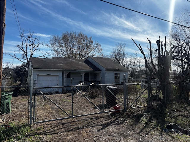 4124 Dabney St, Houston, TX 77026 - view of front of property with a fenced front yard, a garage, driveway, and a gate