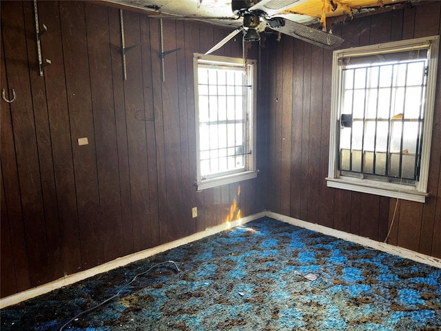 4124 Dabney St, Houston, TX 77026 - carpeted spare room featuring ceiling fan and wooden walls