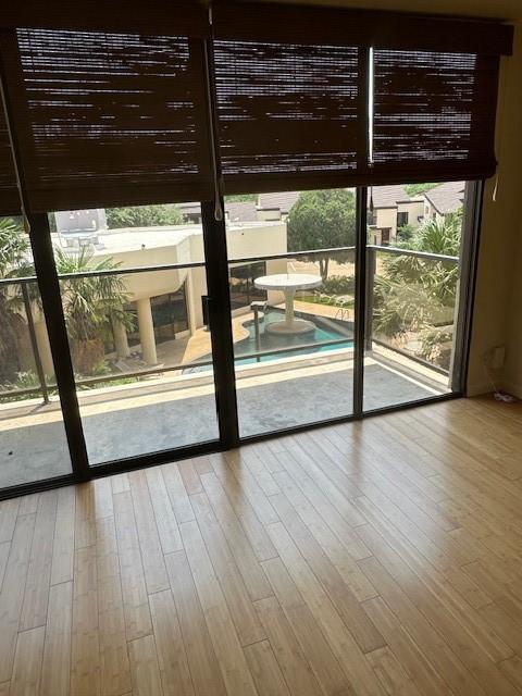 40 N Interstate 35 Unit 3D3, Austin, TX 78701 - doorway to outside with wood finished floors