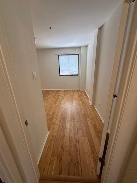 40 N Interstate 35 Unit 3D3, Austin, TX 78701 - unfurnished room featuring light wood-style flooring and baseboards