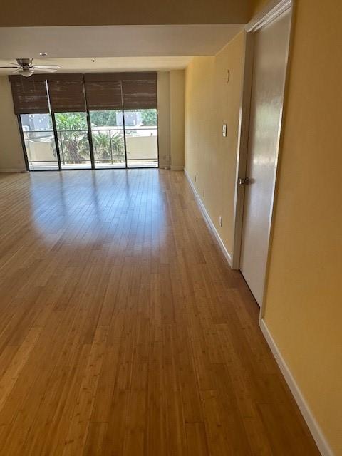 40 N Interstate 35 Unit 3D3, Austin, TX 78701 - empty room featuring wood finished floors and ceiling fan