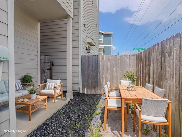 11016 Crescent Light Way, Houston, TX 77043 - view of patio featuring an outdoor living space