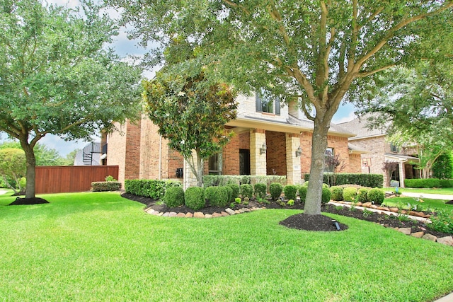 9303 Georgetown Glen Cir, Cypress, TX 77433 - obstructed view of property featuring brick siding and a porch